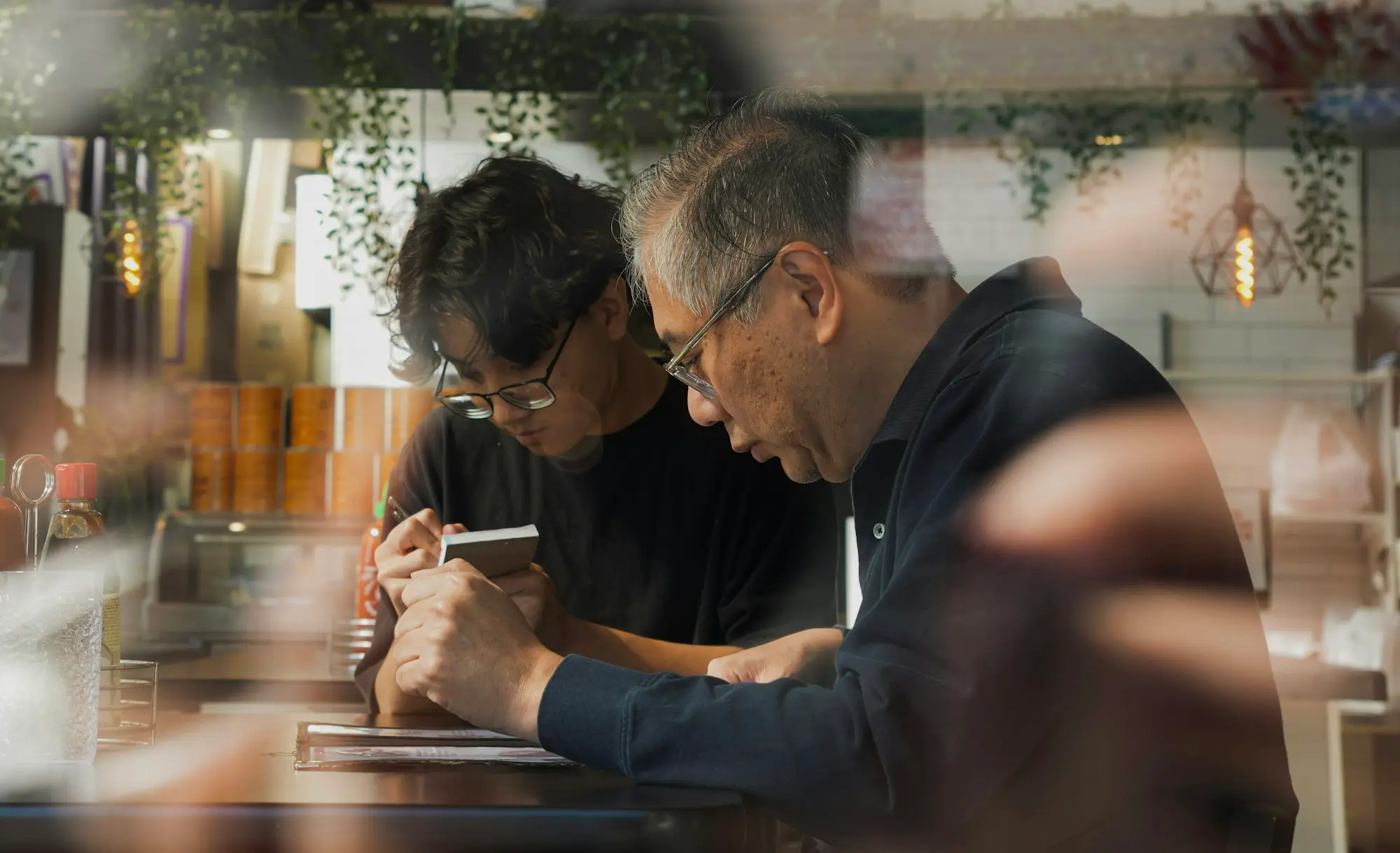 Cafe owners reading a profit and loss report together