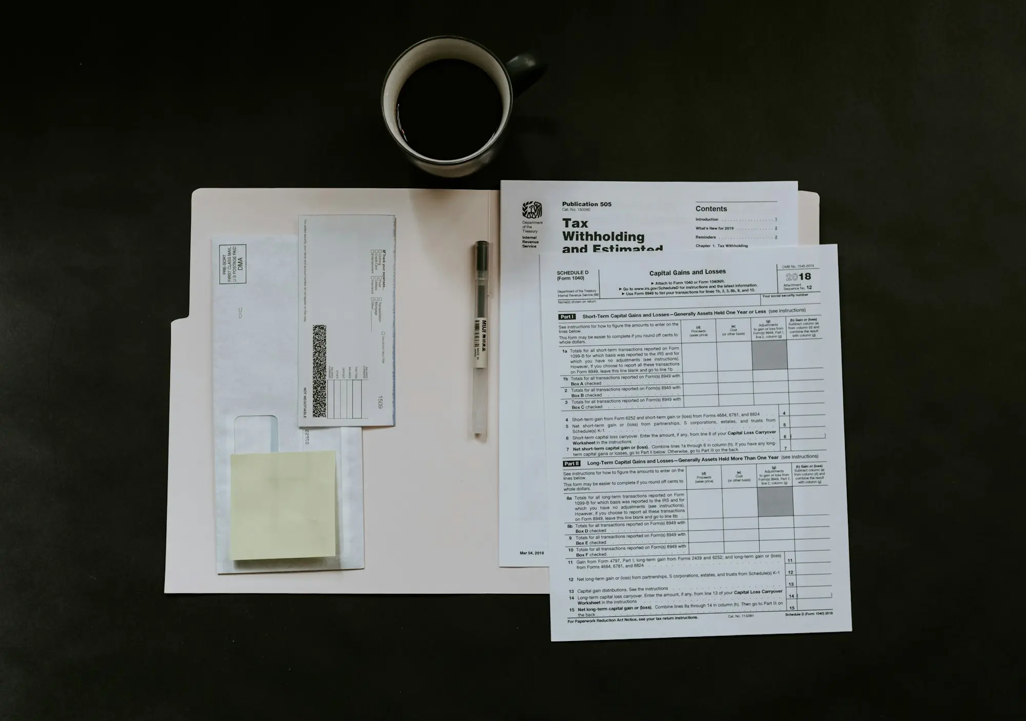 Invoices and forms spread across an office desk