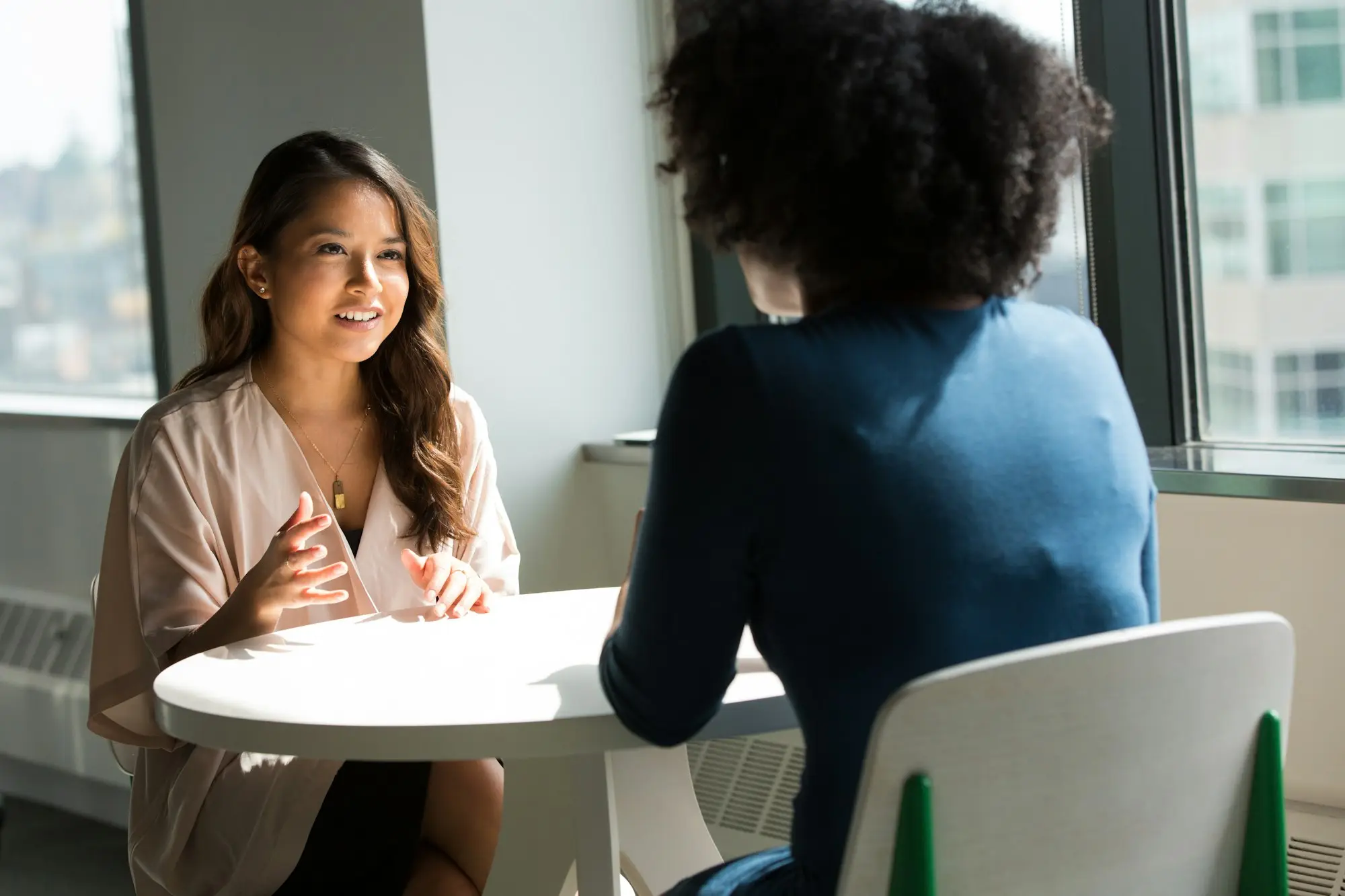 Business owner interviewing a candidate for her first hire