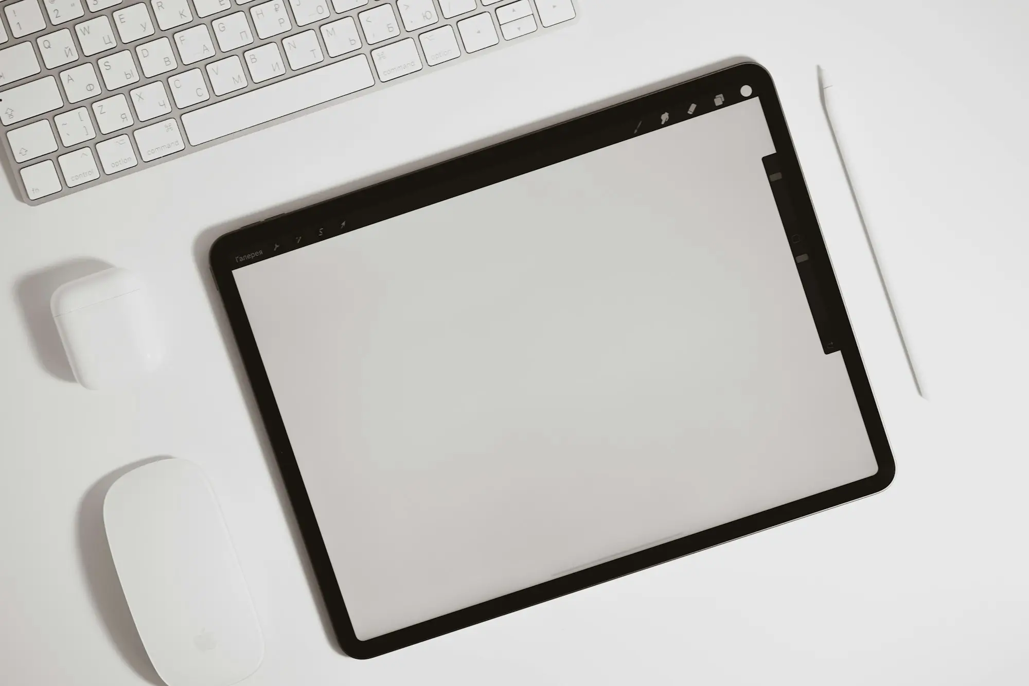 Tablet and keyboard on a desk ready for writing up a job quote